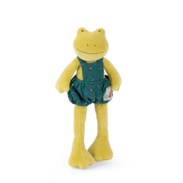 A plush toy frog wearing a dark green floral pair of overalls, photographed against a plain white background.
