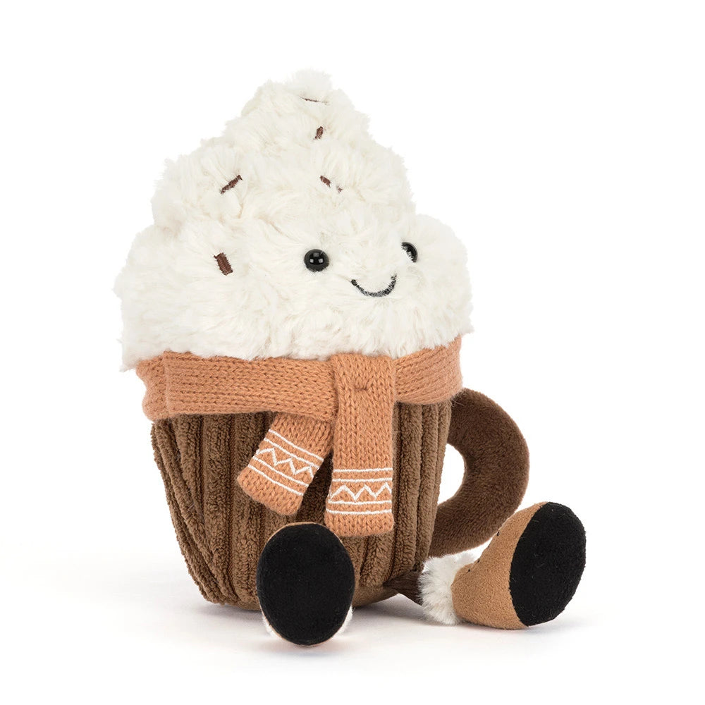 A plush hot chocolate toy with fluffy white cream, a brown mug base, and a tan knit scarf, photographed on a clean white background.